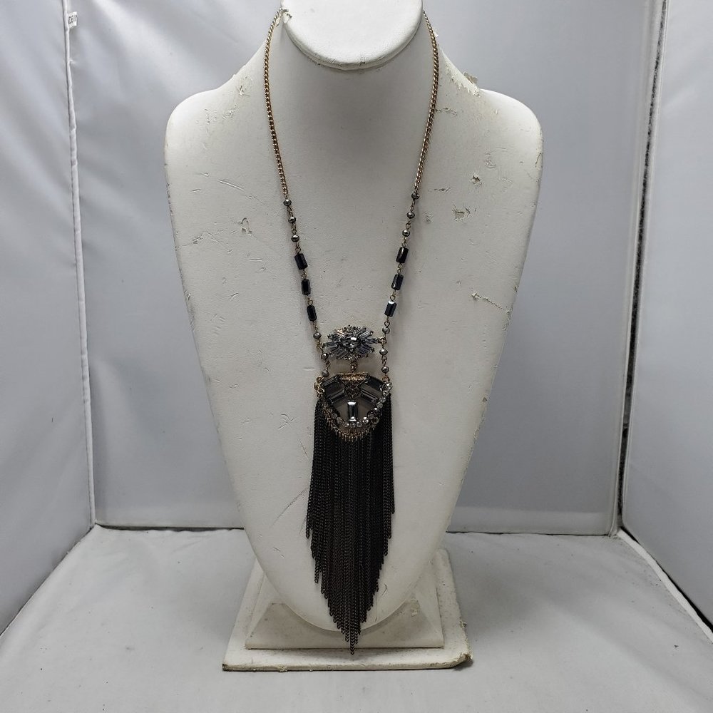 Festive gold chain fringe tassel necklace with clear and black stones